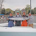 Team Hooyah and the 88 lb wahoo that won the 2009 Hook A Hoo Rodeo by 49lbs caught on Baitmasters select ballyhoo rigged split bill naked.