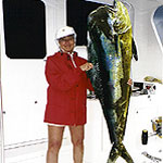 Penny Rennison with a 63 lb bruiser bull dolphin caught on a Baitmasters medium ballyhoo