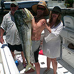 Jorge Solares and his wife Rosario and their 57 lb dolphin caught on a Baitmasters medium ballyhoo double hook on mono.
