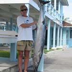 Betty Wigder and her wahoo caught on Baitmasters Bait!
