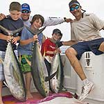 Jacob Rathbun, Chris Rathbun, Jarrod Rathbun, Nicholas Jacobs, and Dan Jacobs with photo taken by Mike Mazur, in the Yellowfin Tuna Monster had a banner day in Ponce Inlet, Florida using Baitmasters Bait!